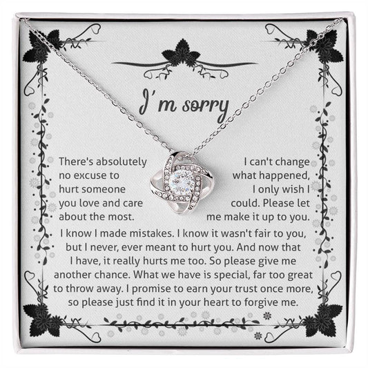 owning my mistake, an apology from the heart, message card with love knot pendant to show regret.