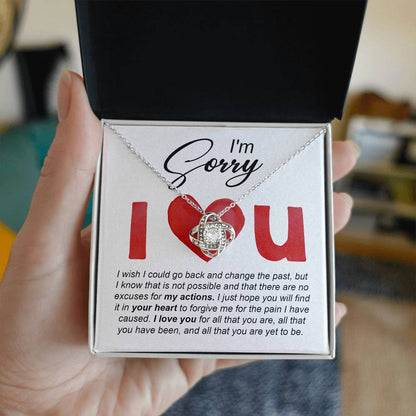 I love you, so sorry I hurt you. Send a message card apology with a heart warming gift, love knot pendant necklace.