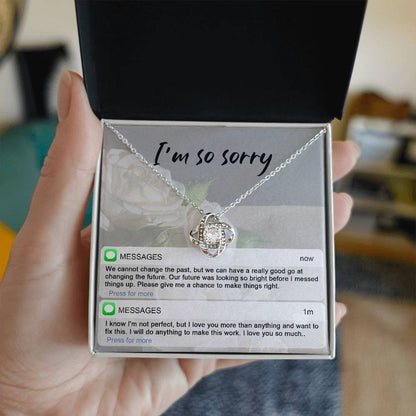 Real time text message apology except on message card together with love knot pendant necklace.