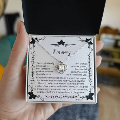 owning my mistake, an apology from the heart, message card with love knot pendant to show regret.