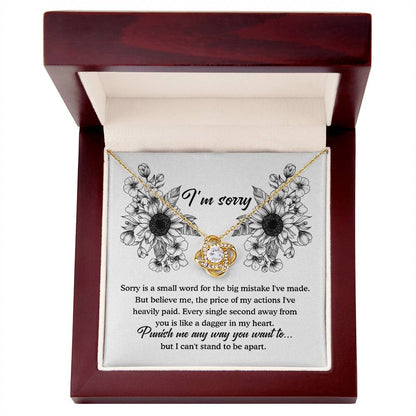 An apology filled with remorse, truly sorry for hurting you message card with love knot pendant necklace.