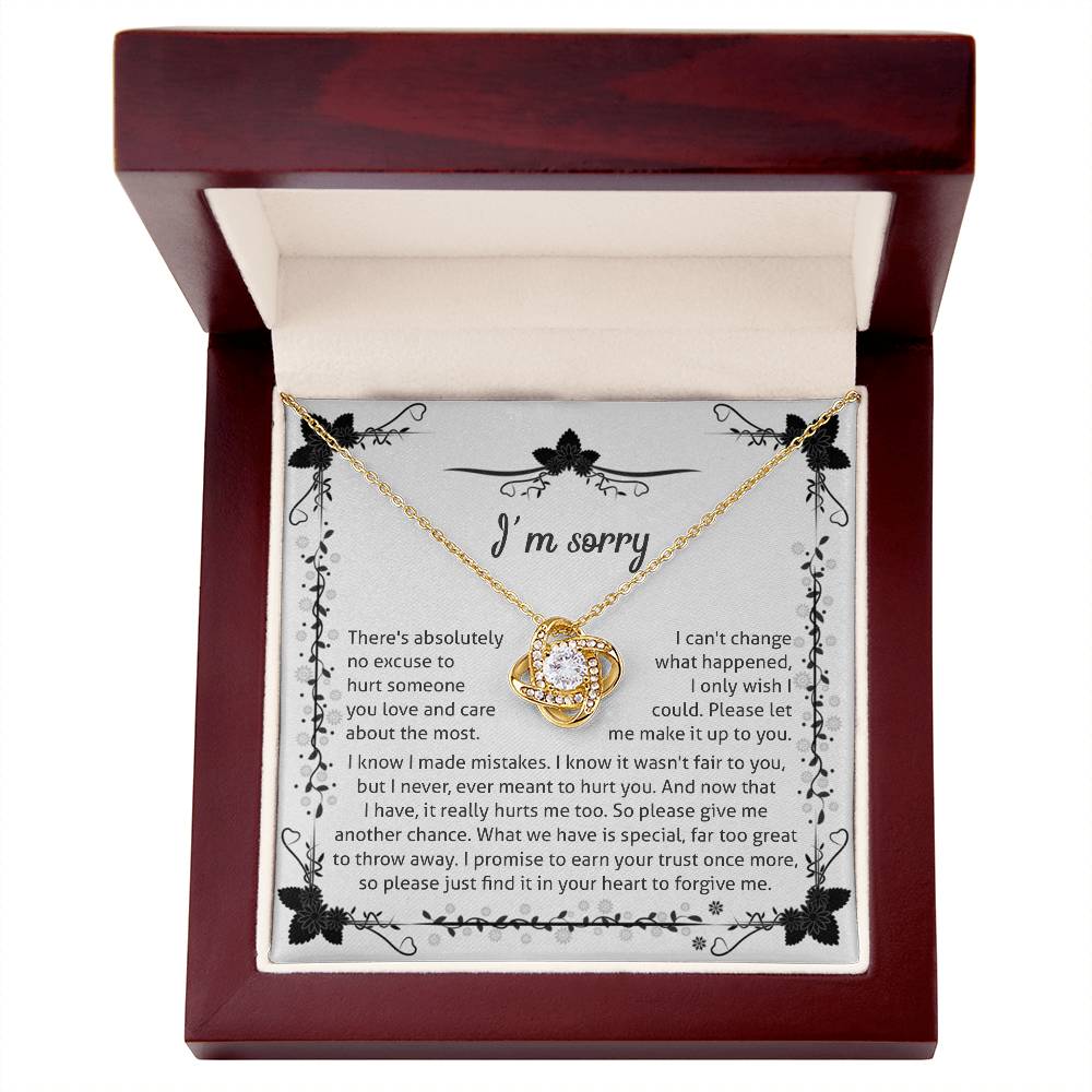 owning my mistake, an apology from the heart, message card with love knot pendant to show regret.