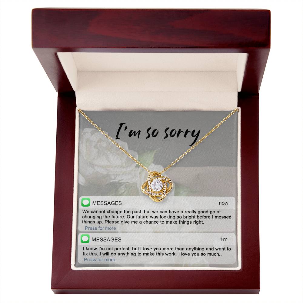 Real time text message apology except on message card together with love knot pendant necklace.