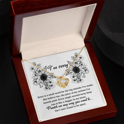 An apology filled with remorse, truly sorry for hurting you message card with love knot pendant necklace.