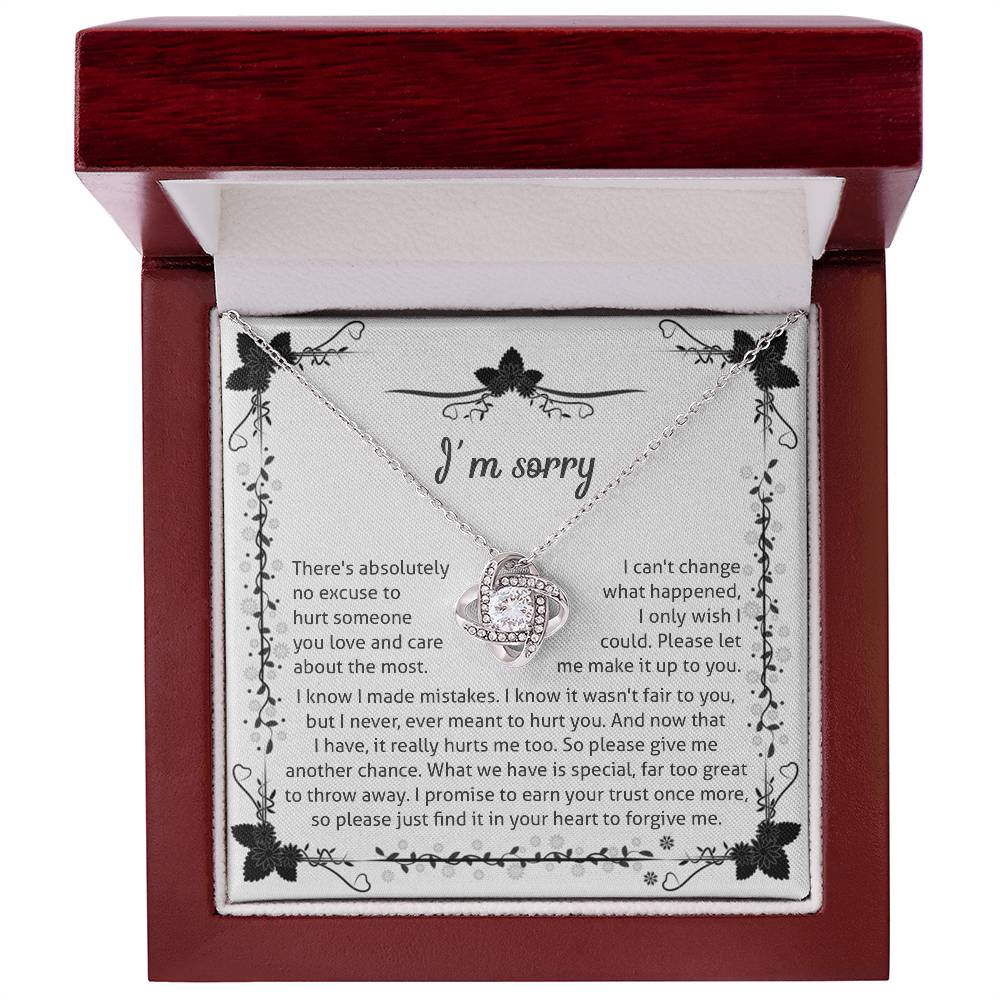 owning my mistake, an apology from the heart, message card with love knot pendant to show regret.