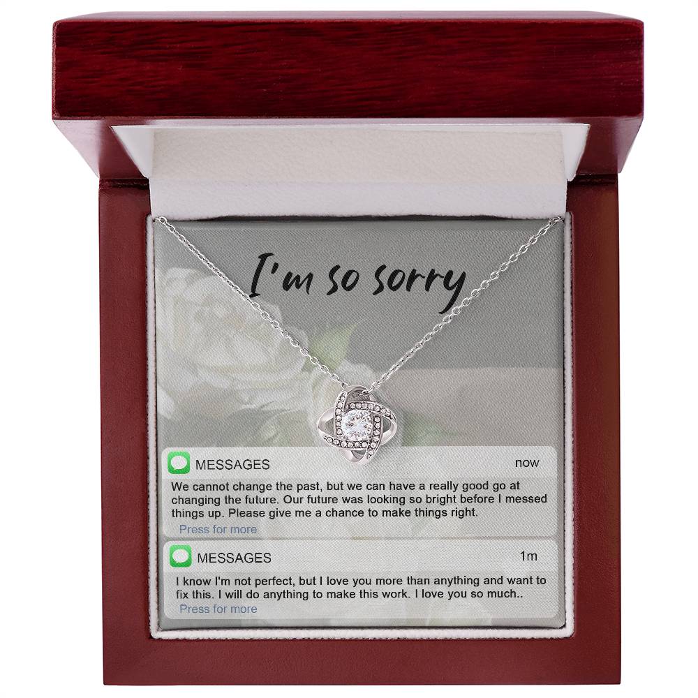 Real time text message apology except on message card together with love knot pendant necklace.